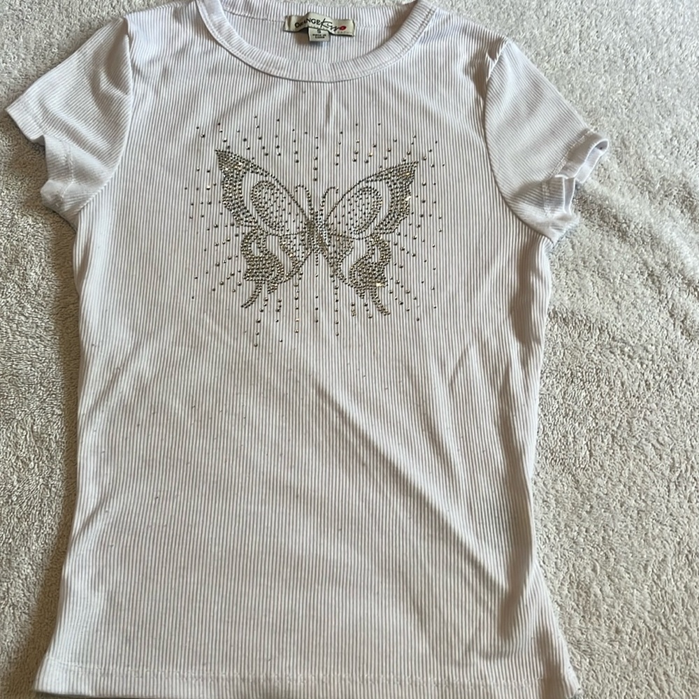 This is a total white shirt either a pretty butterfly